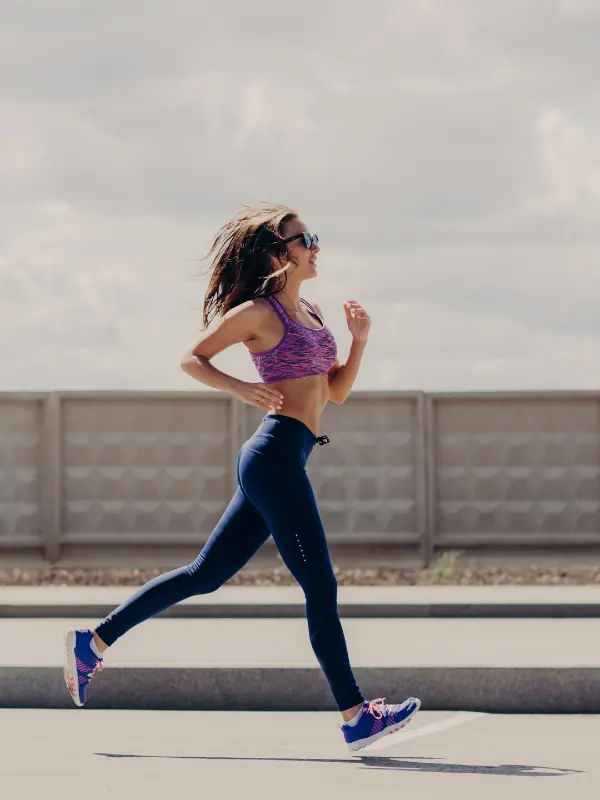 Woman running outdoors to support an active, healthy lifestyle through naturopathic care.